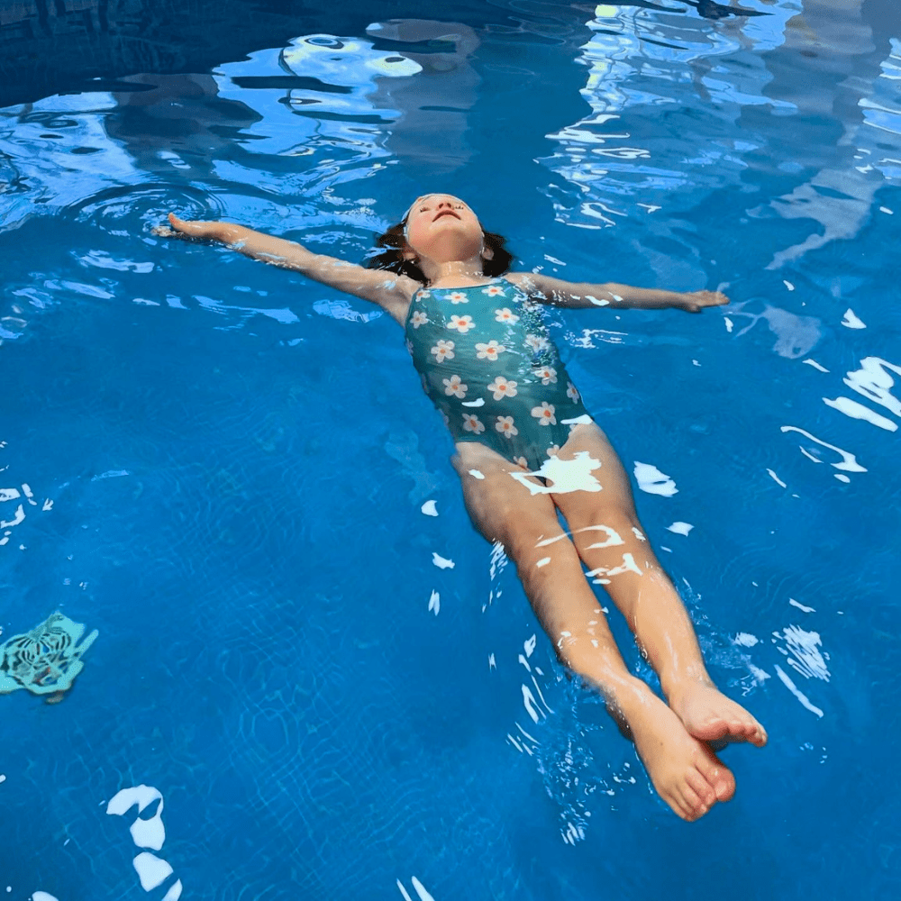 kidtastic young girl floating in pool