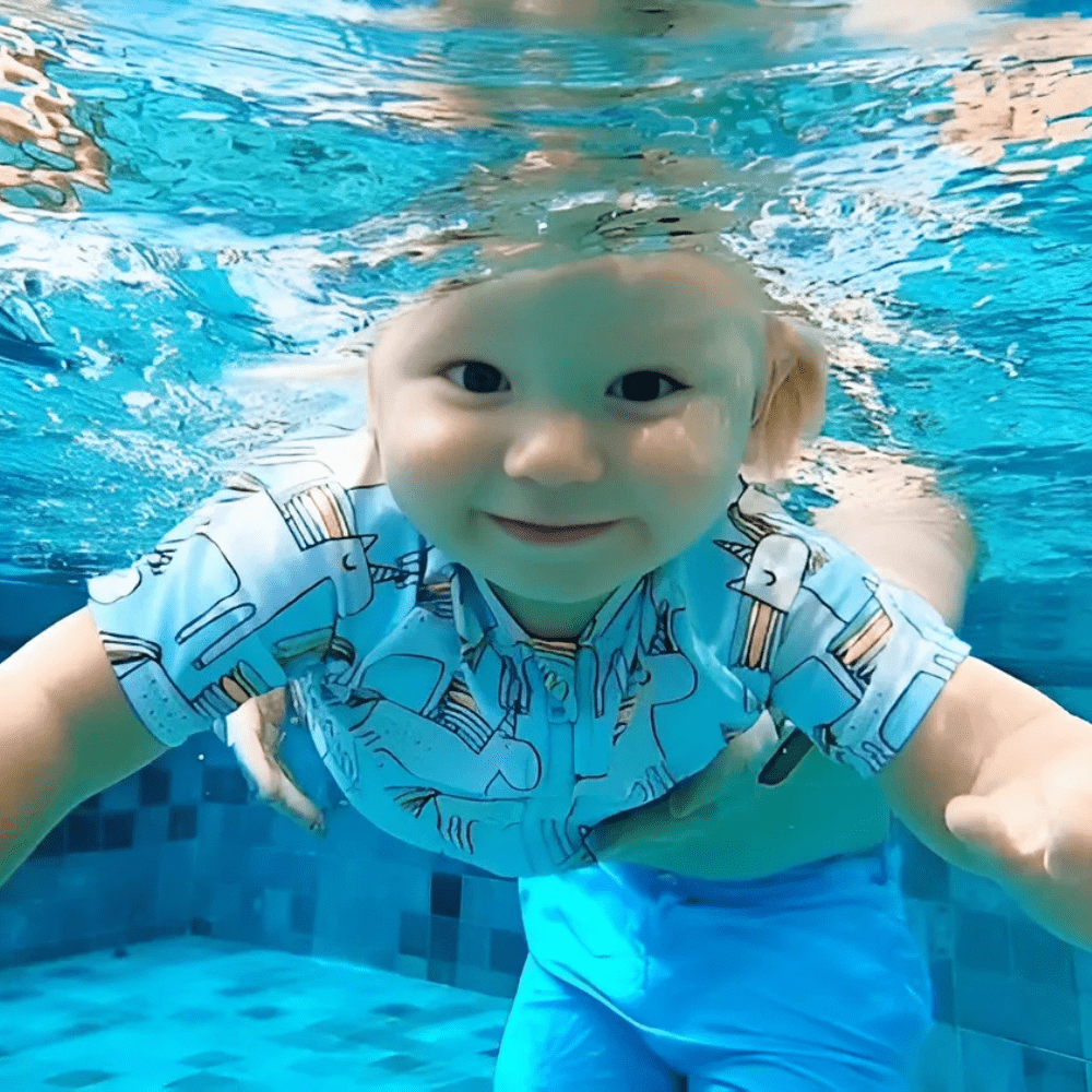 kidtastic toddler smiling under water